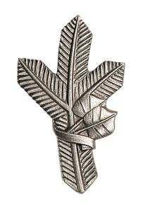Badge on lapels - silver pine twig left