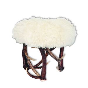 Round tabouret with sheep fur.